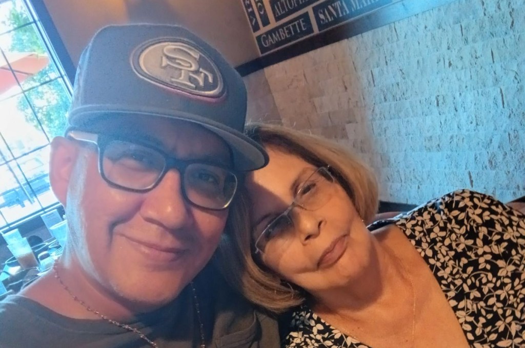 a man with his mother in a selfie