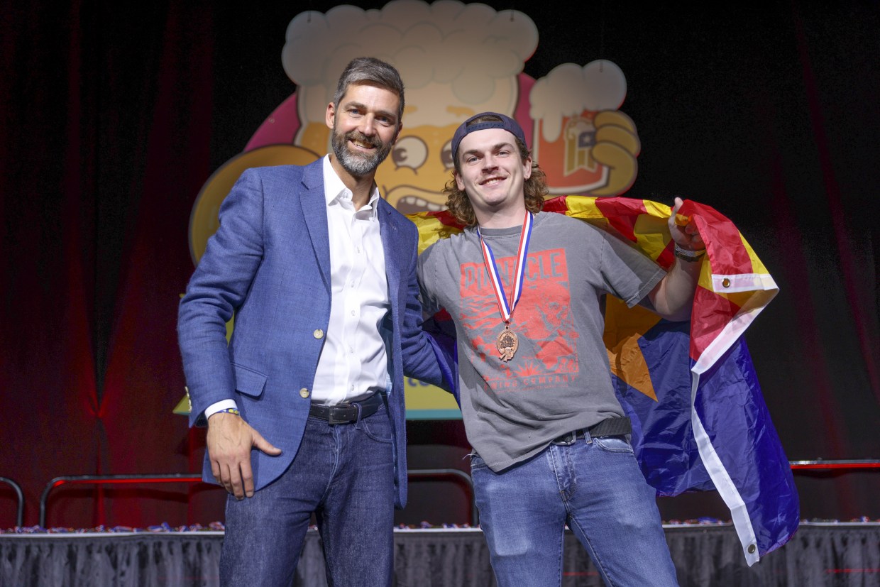 Two men pose for award at Great American Beer Festival.