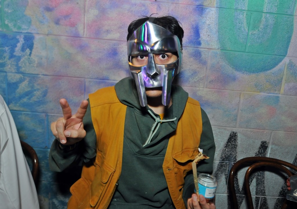 A man wearing an MF Doom silver mask.