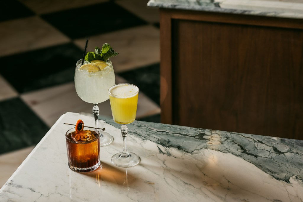 Three cocktails on a table.