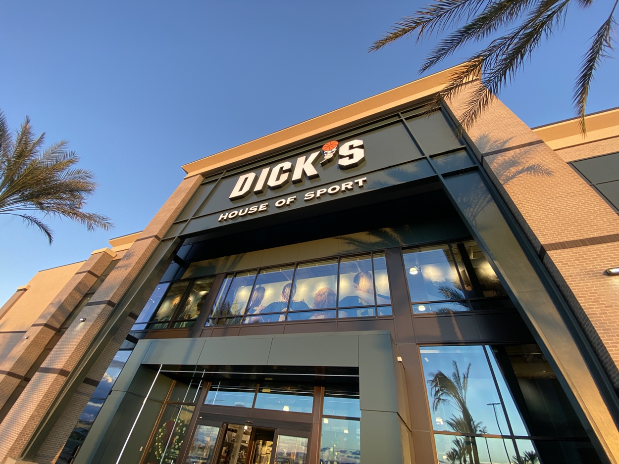 The exterior of a two-story sporting goods store.