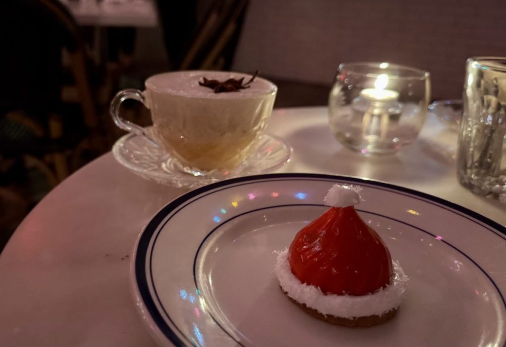 A hot holiday cocktail and Santa hat-inspired dessert.