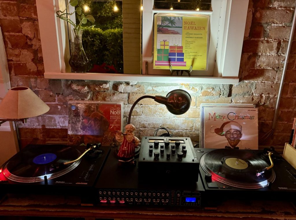 A turntable playing holiday records