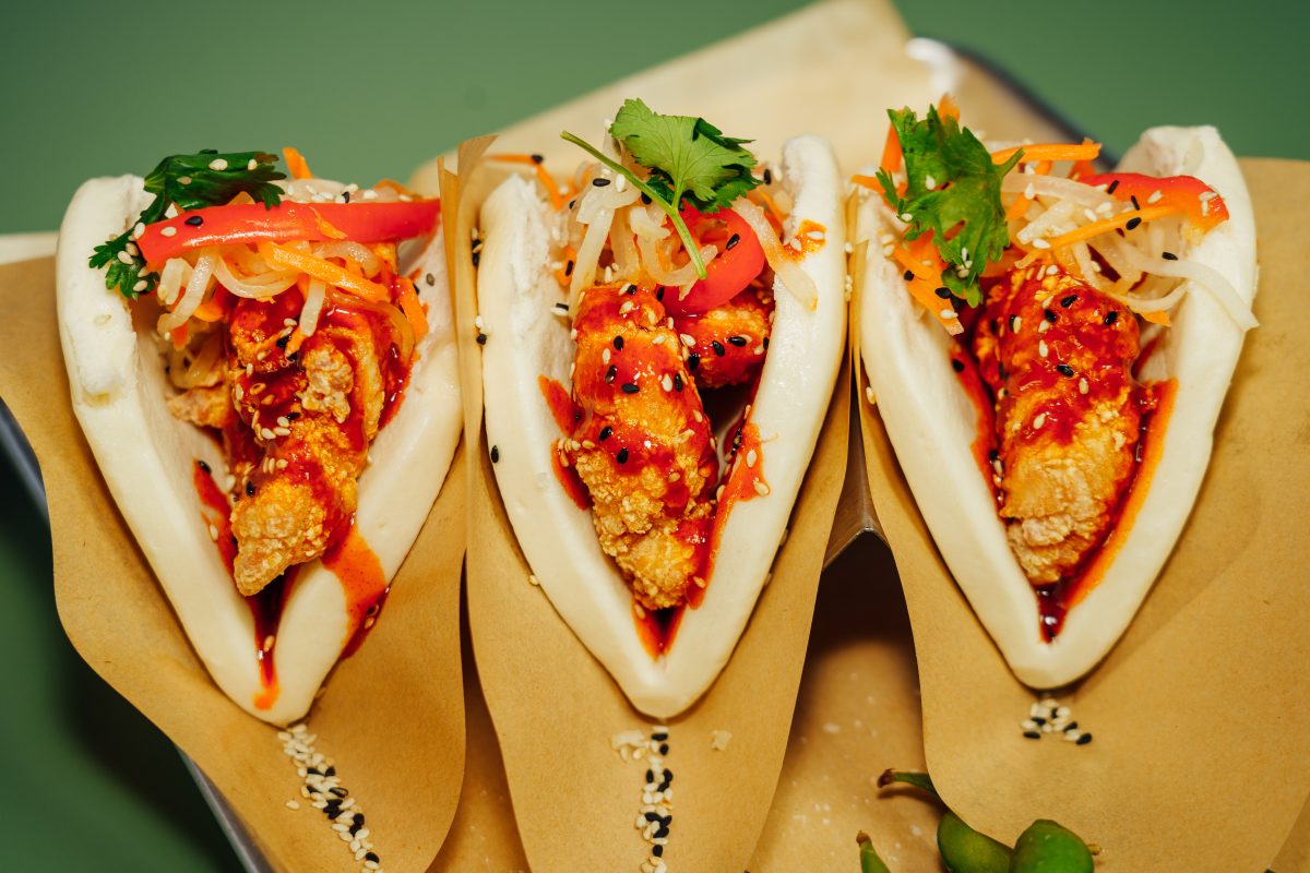 Three bao buns on a tray.
