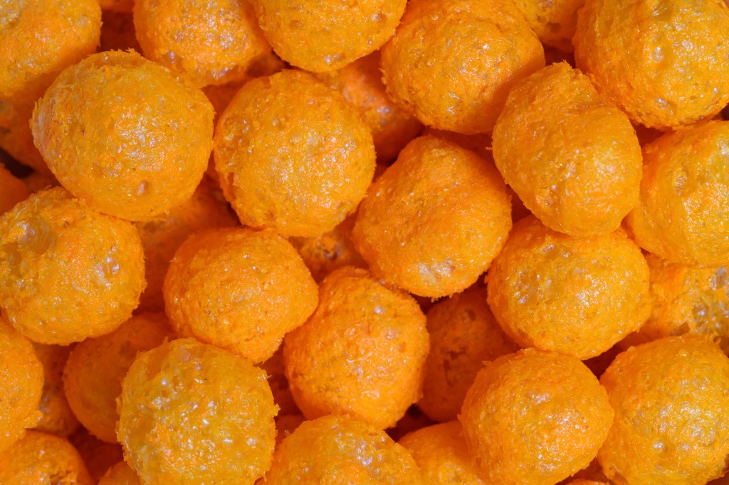 Macro shot of cheese puff balls snack from above