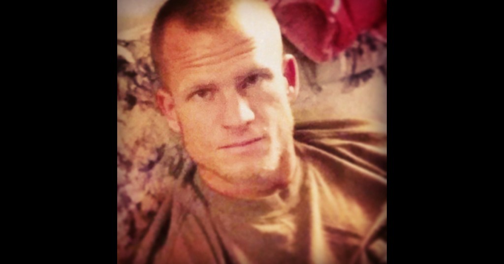 a man with a shaved head