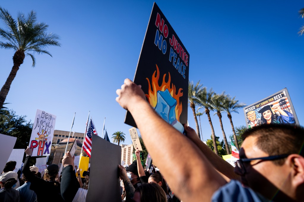 protesters at an anti-ice rally