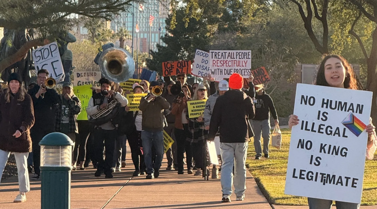 protesters holding anti-ice signs