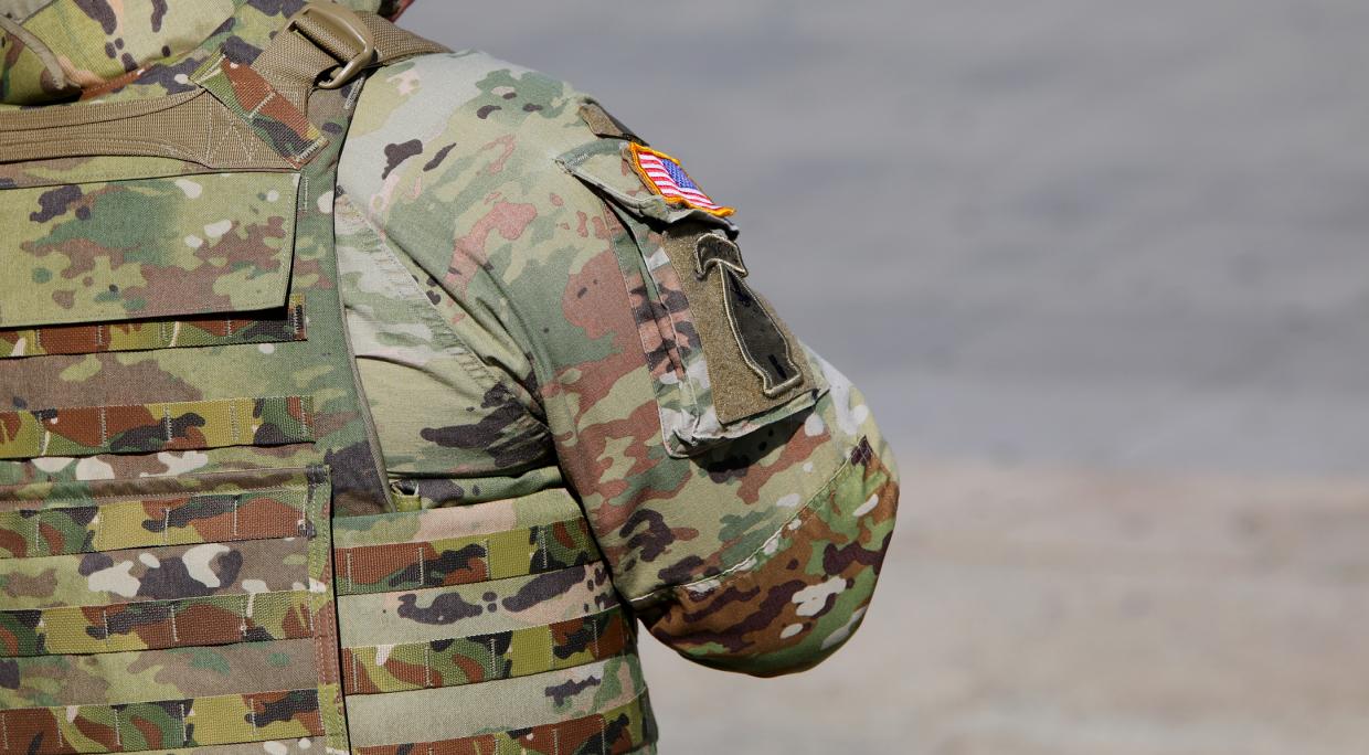 A stock photo of a soldier in fatigues.