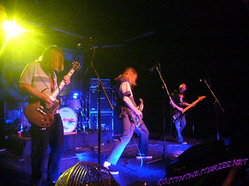 A band plays on a stage.