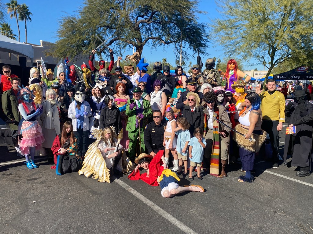 A large group of cosplayers pose together at Superhero Saturday 2026 in north Phoenix, featuring Star Wars, Marvel, DC, anime and video game characters in costumes.