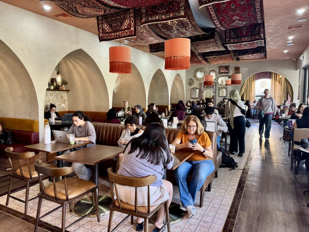 Inside a busy Middle Eastern-inspired cafe