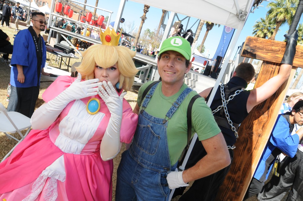 Cosplayers dressed as Princess Peach and Luigi at Arizona Matsuri 2026 in Phoenix.
