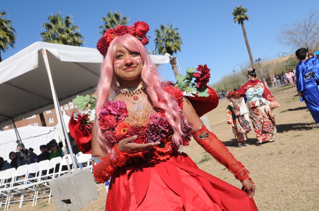 A female cosplayer dressed as a character from the 2021 fantasy anime “Belle" at Arizona Matsuri 2026.