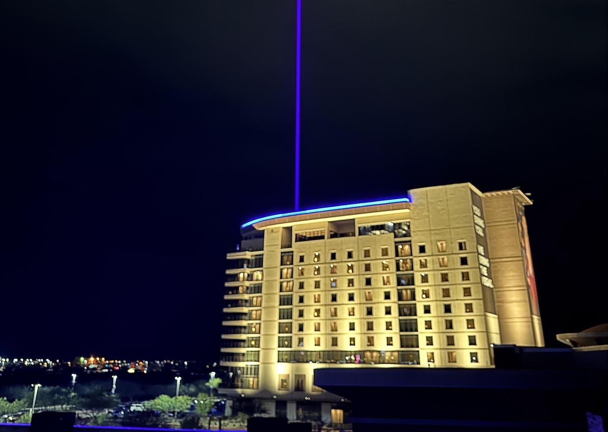 A bright blue Gila Beam shoots into the night sky above Gila River Casino & Hotel Wild Horse Pass near Chandler.