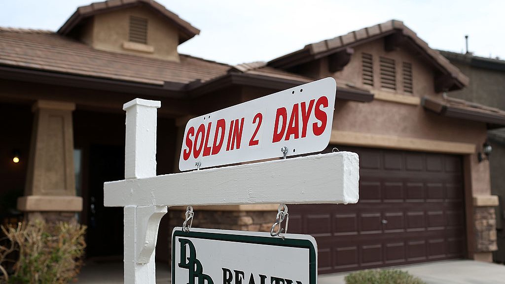 A sold sign is posted in front of a home on in Phoenix.