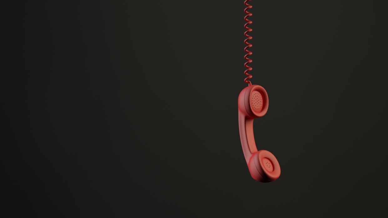 a hanging red phone receiver