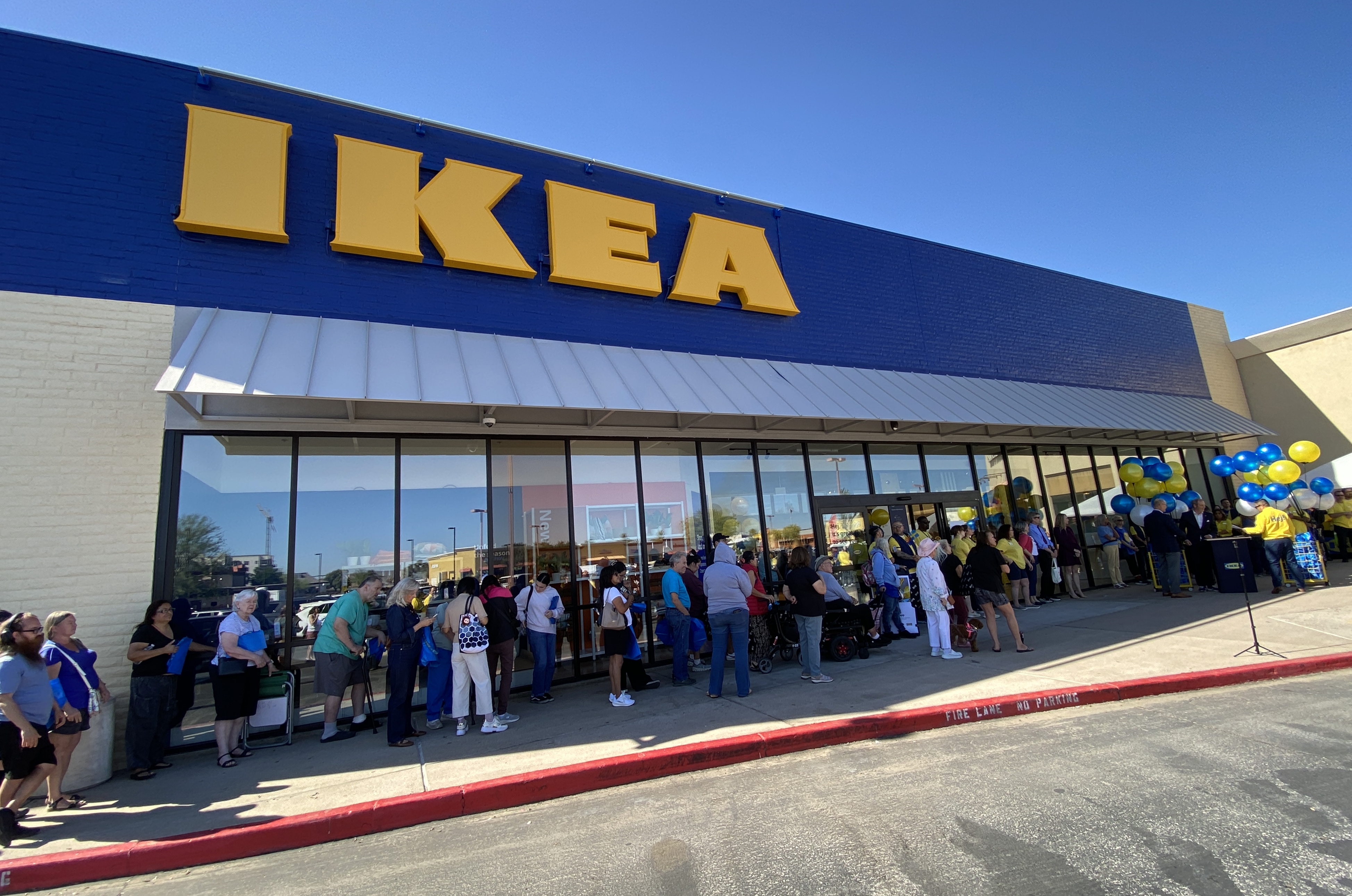Shoppers line up outside the new IKEA in Phoenix on opening day as the store welcomes thousands of customers