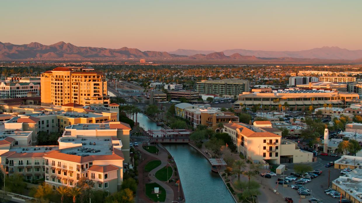 Aerial shot of Scottsdale, Arizona during a golden sunset in spring.