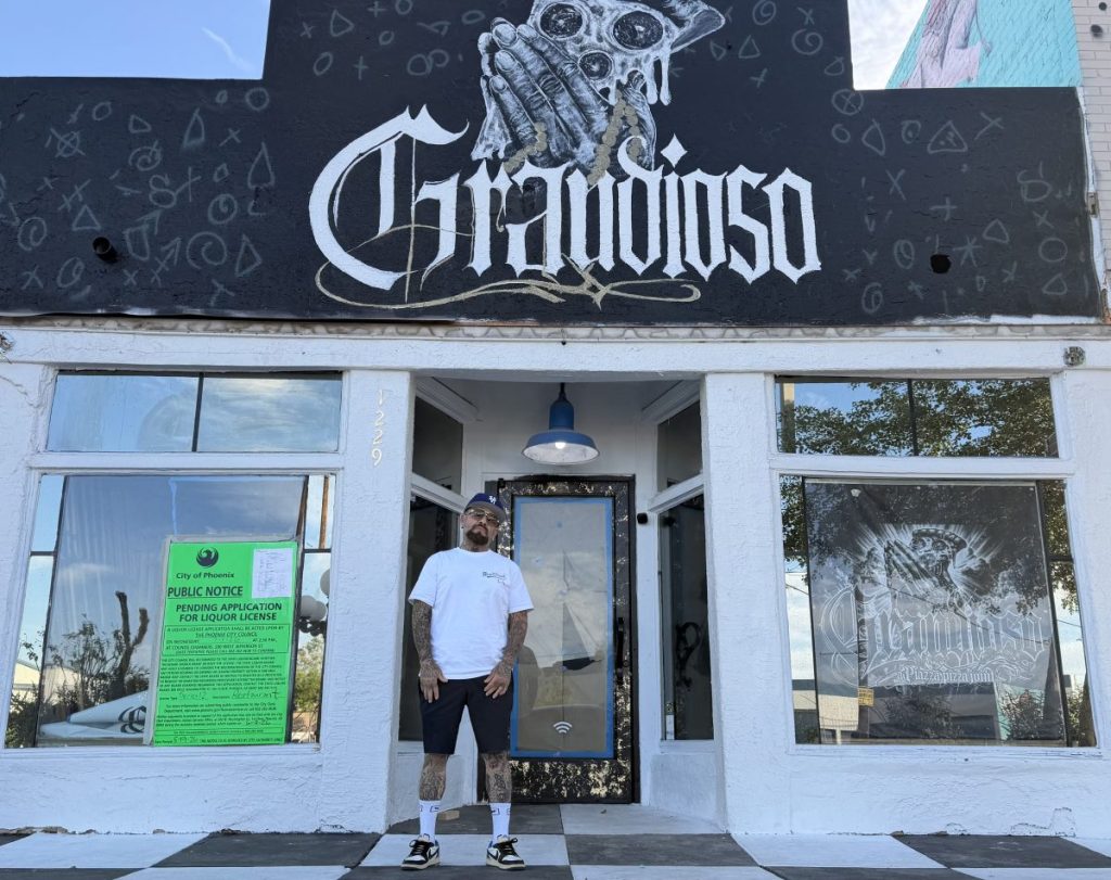 Grandioso owner Justin Piazza in front of his pizzeria.