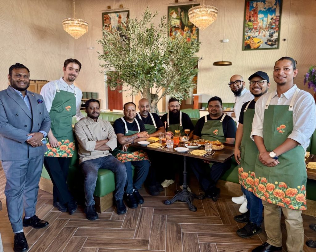 Nadu's kitchen, bar and management team pose in the restaurant's dining room.