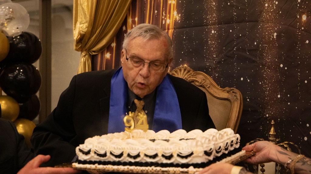 joe arpaio blows out candles on a birthday cake