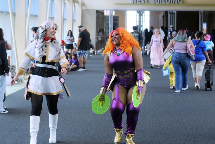 Cosplayers walk through the skybridge between the North and West buildings of the Phoenix Convention Center during Phoenix Fan Fusion 2026 on Sunday, June 7.