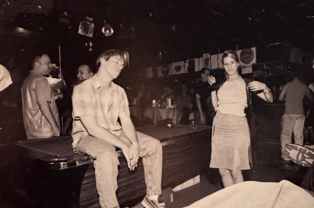 Patrons hang out near the dance floor inside The Pumphouse in Phoenix during the 2000s.
