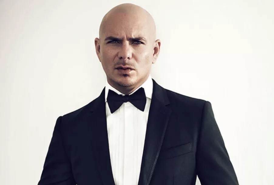 A man in a tuxedo against a white background.