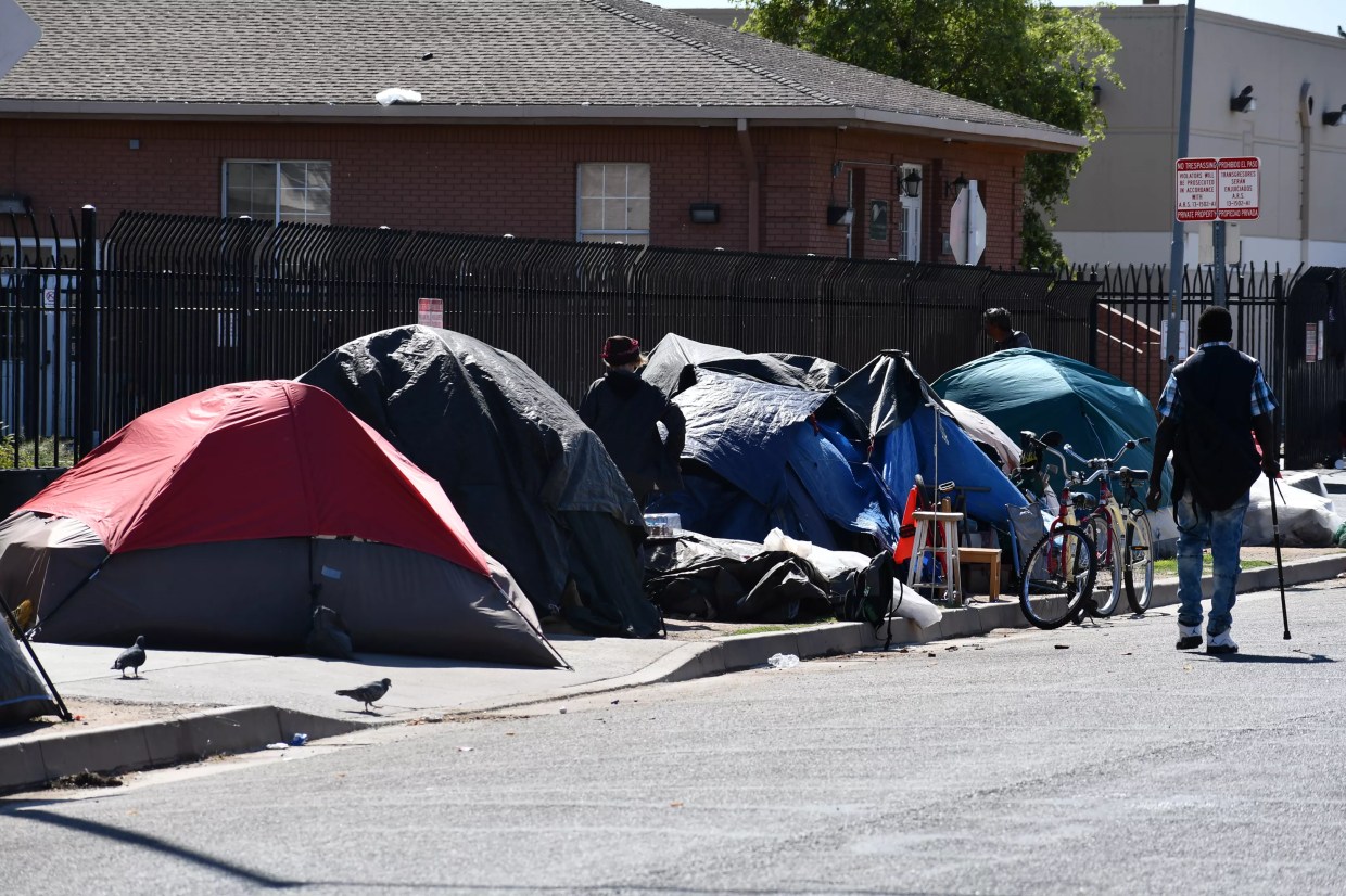 As COVID-19 Threatens Homeless, Phoenix Cops Force Them to Break Down Tents