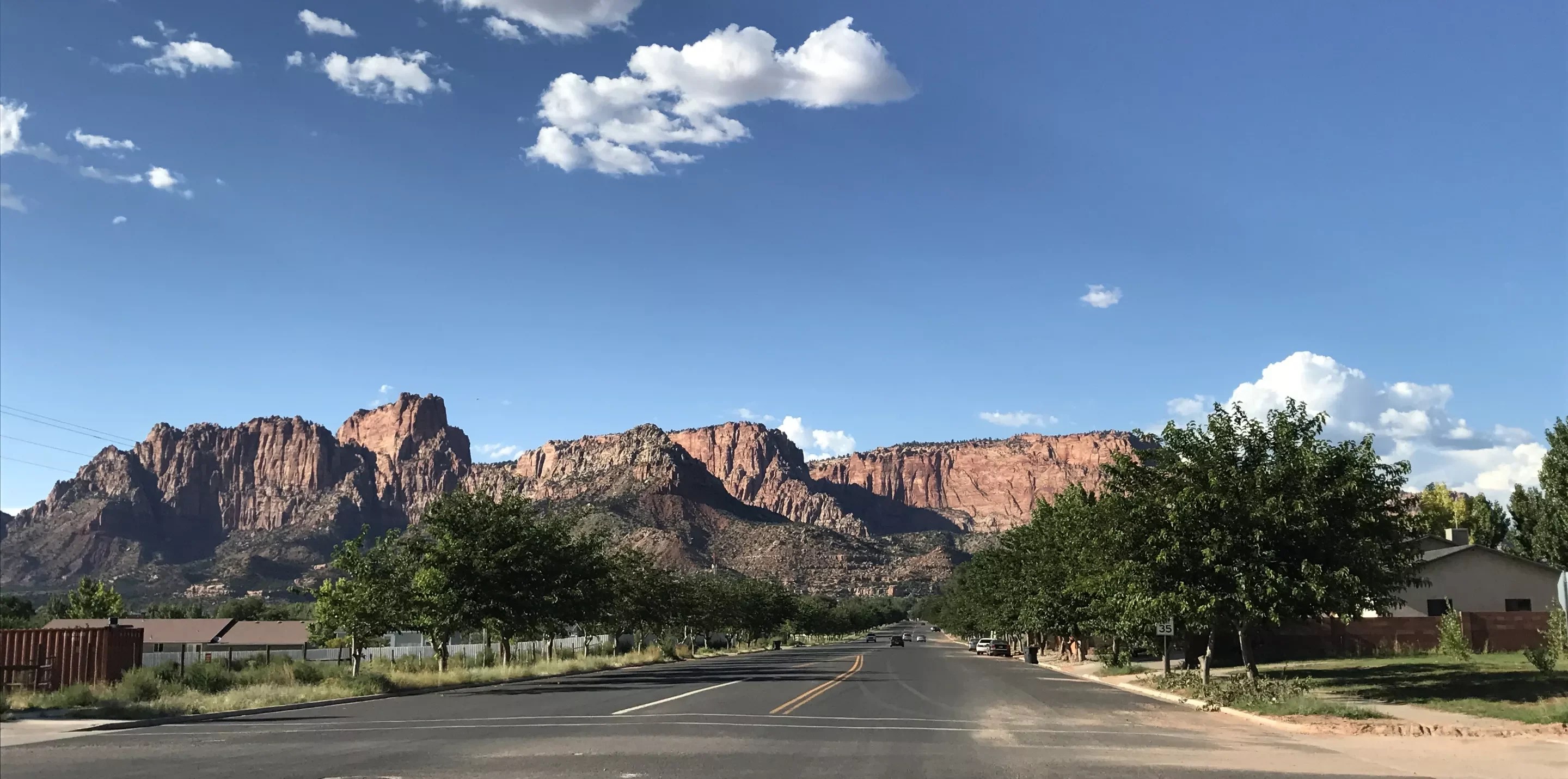 a road leading to desert mountains