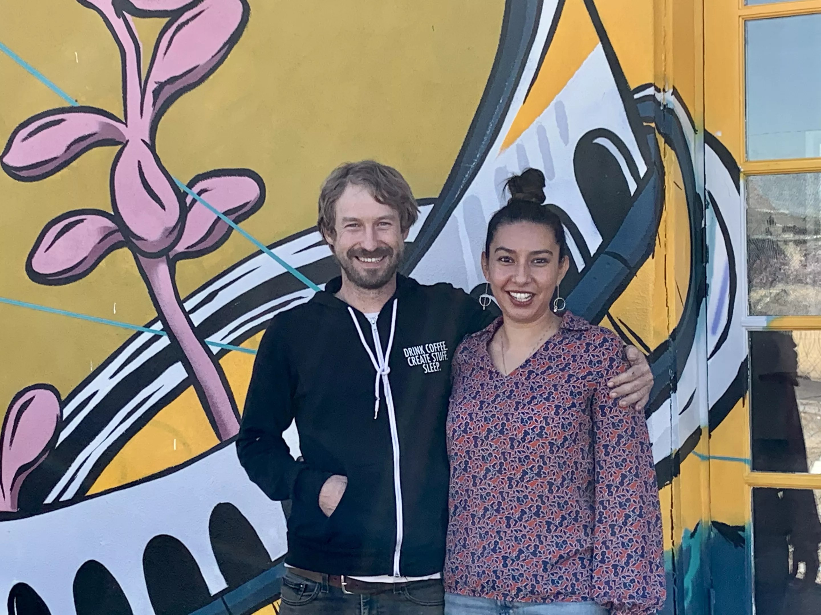 two people pose for a picture