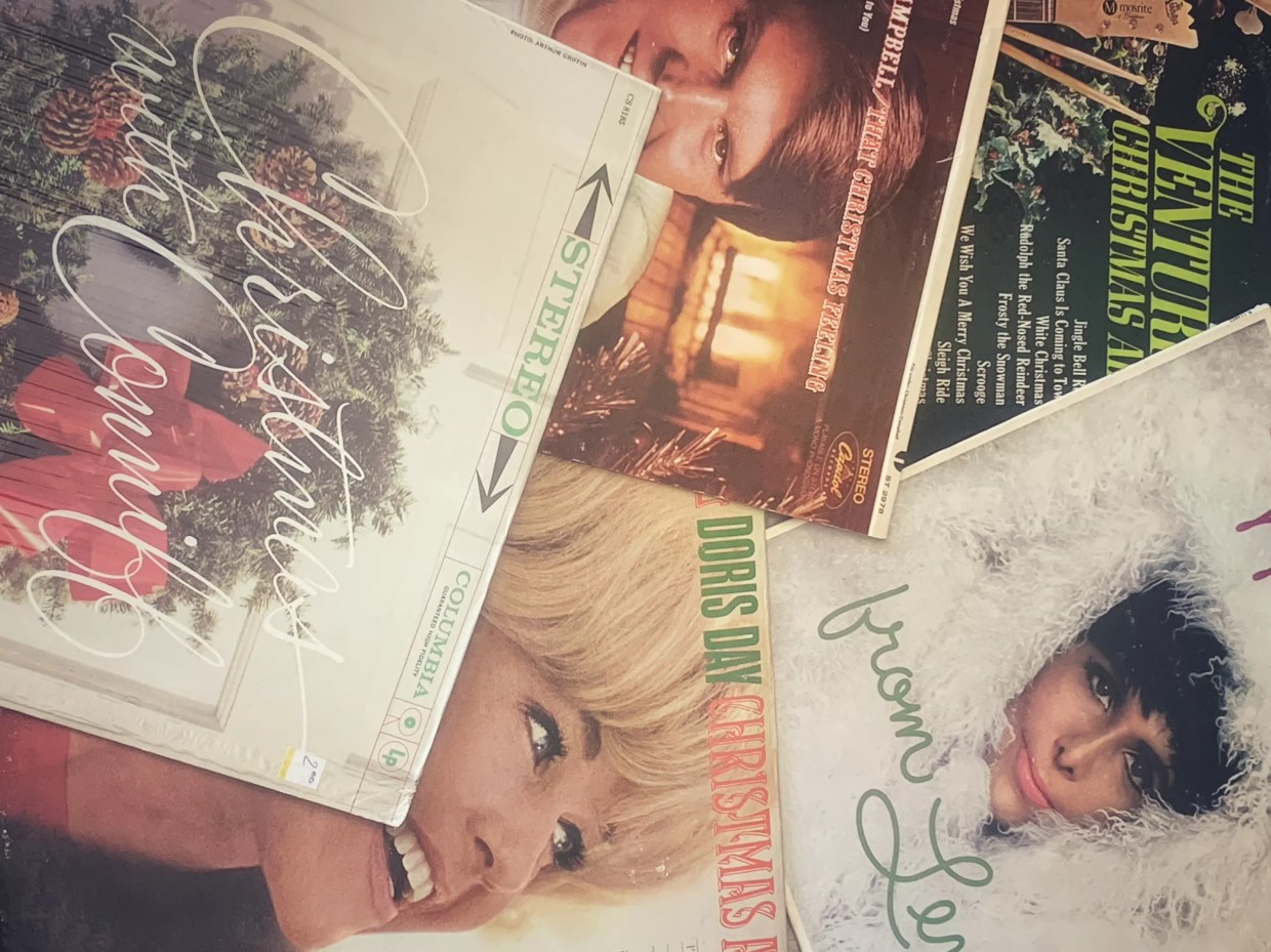 A collage of old Christmas records.