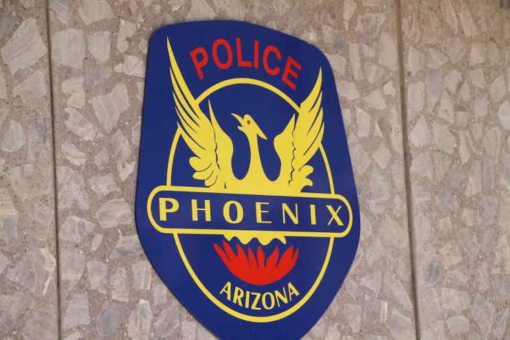 the phoenix police shield on a wall