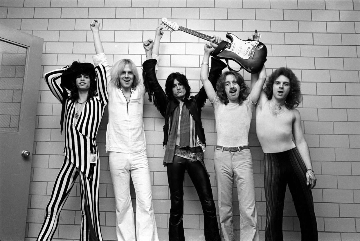 A black and white photo of the rock band Aerosmith.