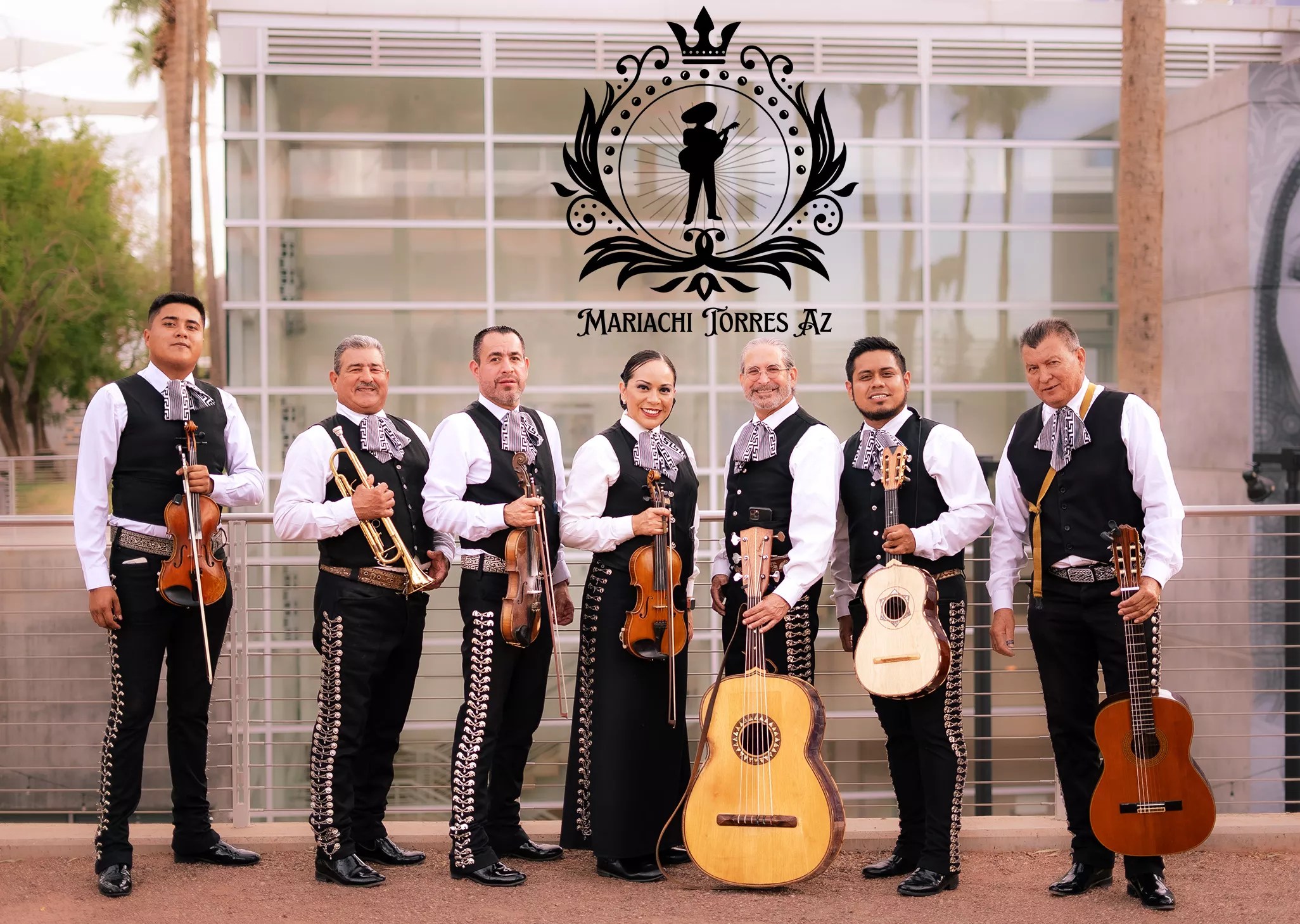 A mariachi band stands in front of Mesa Arts Center.
