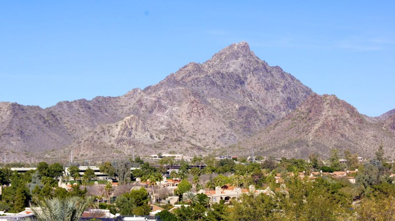 houses below a desert mountain
