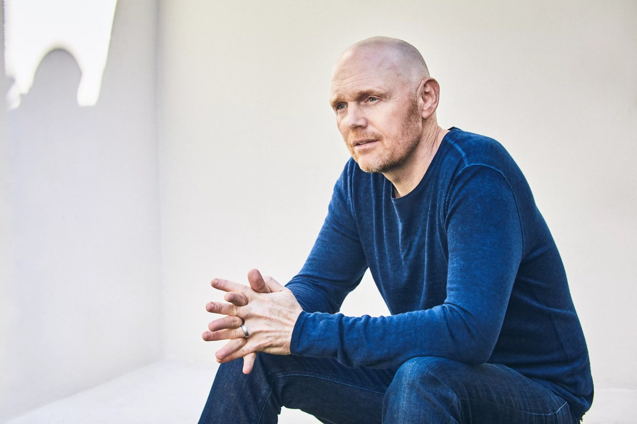 Bill Burr outside wearing a blue shirt