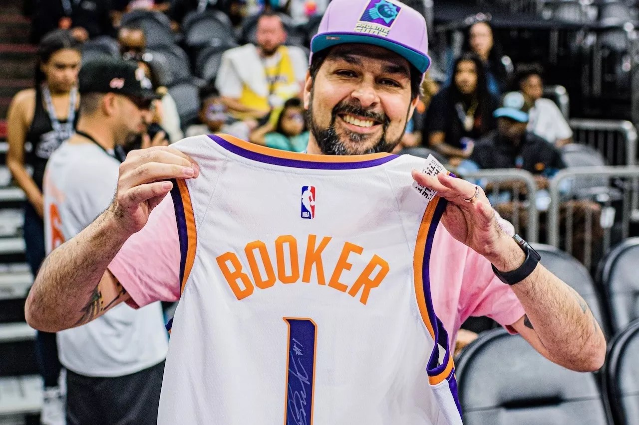 Henry Garcia with autographed Devin Booker jersey