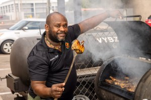 Cool Vybz chef grills chicken.