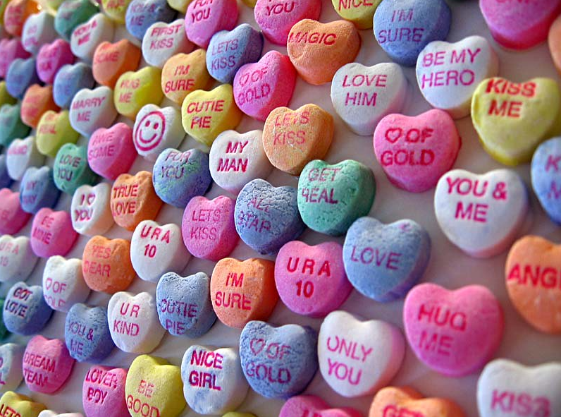 Rows of conversation hearts candy.