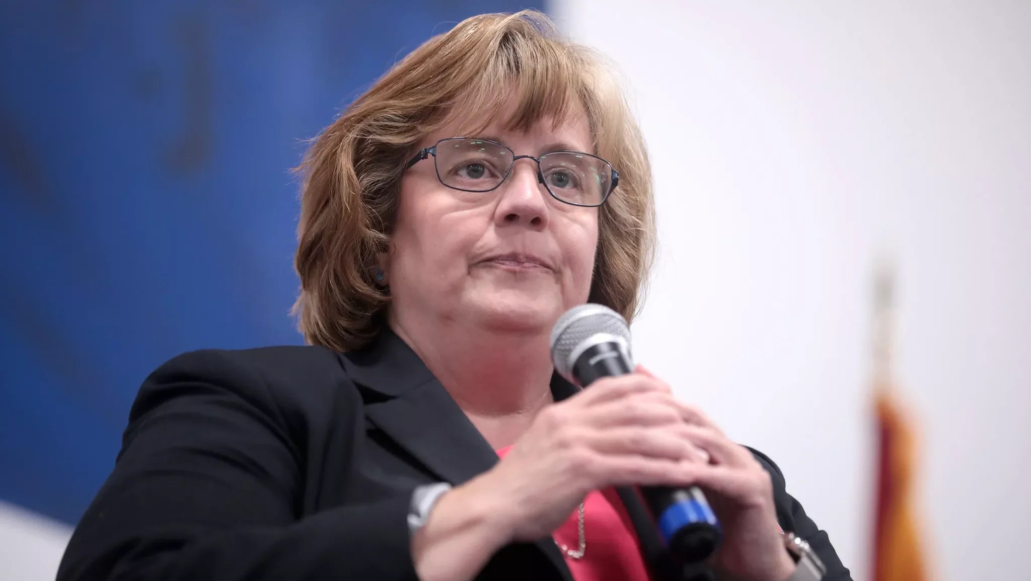 Rachel Mitchell holding a microphone