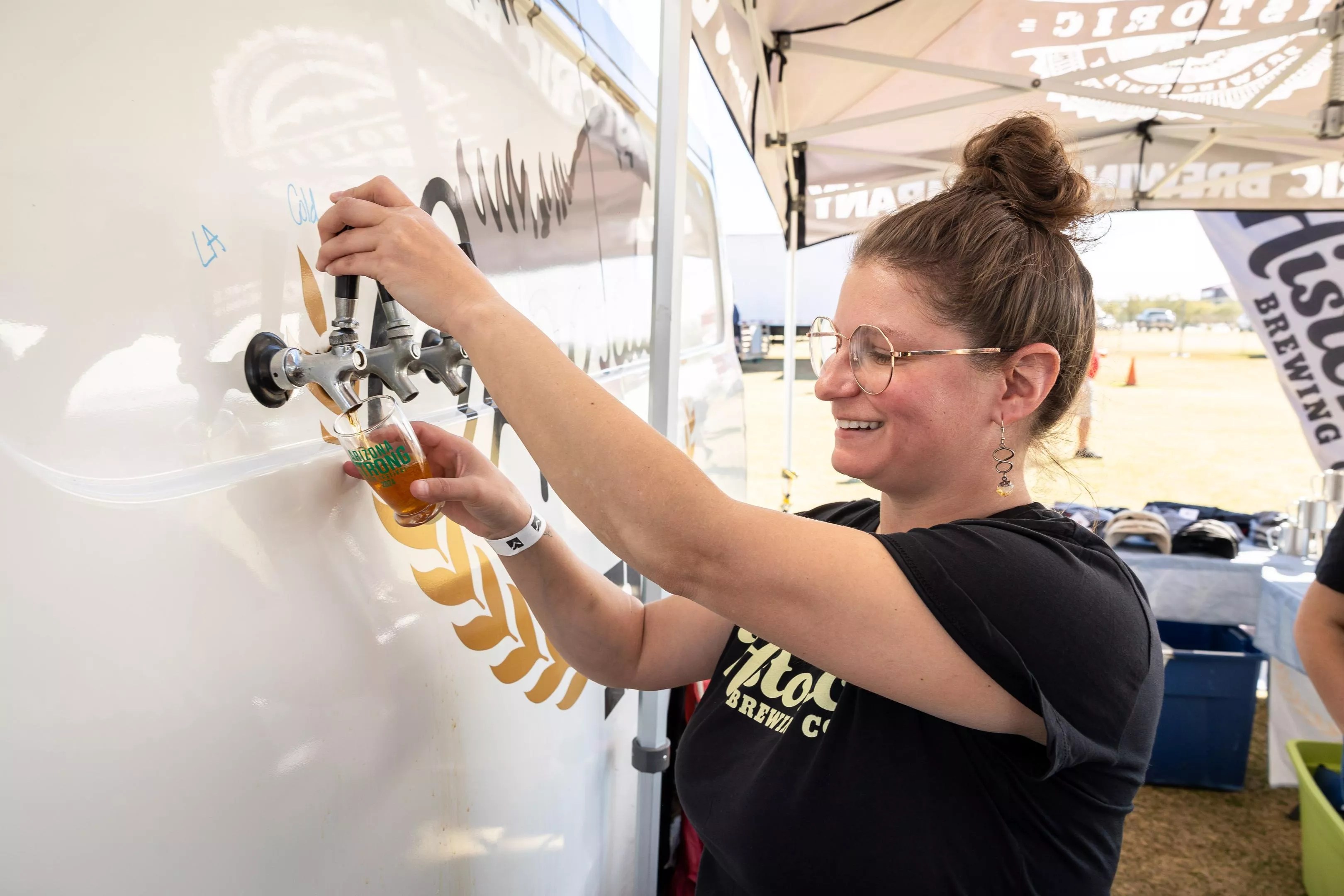 Pouring beer from a trailer.