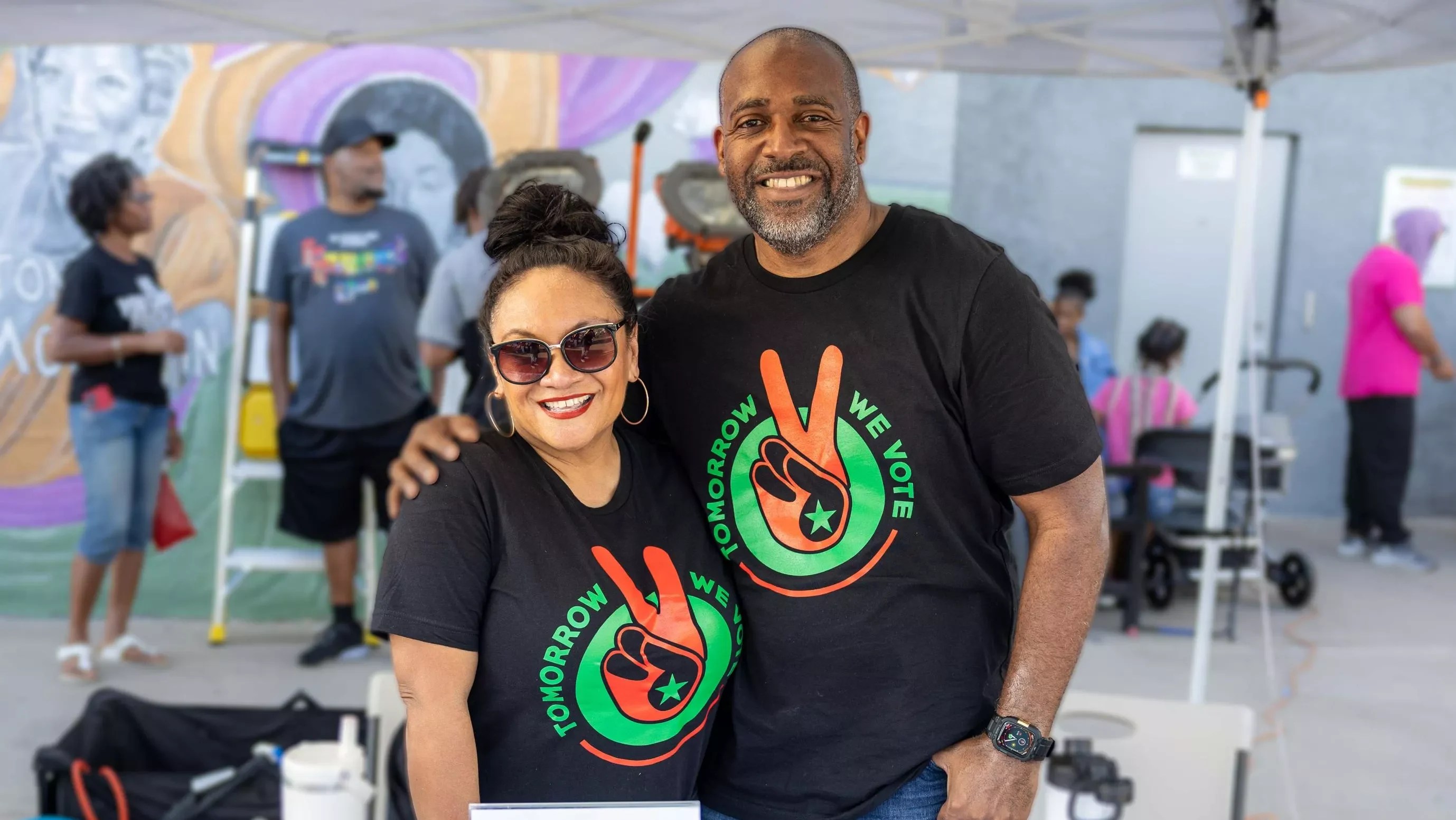 Two people in matching T-shirts.