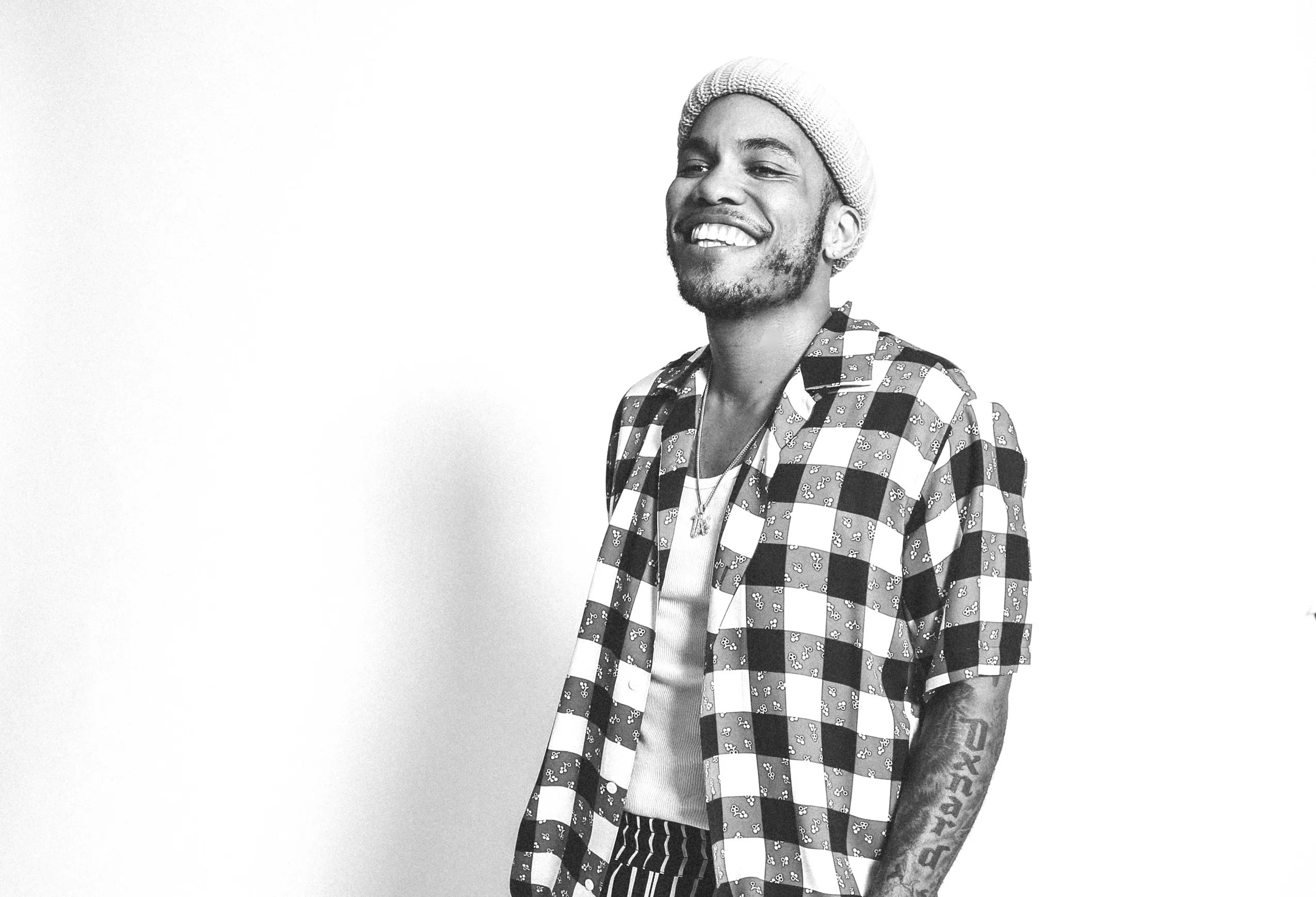 A black and white photo of a Black man.