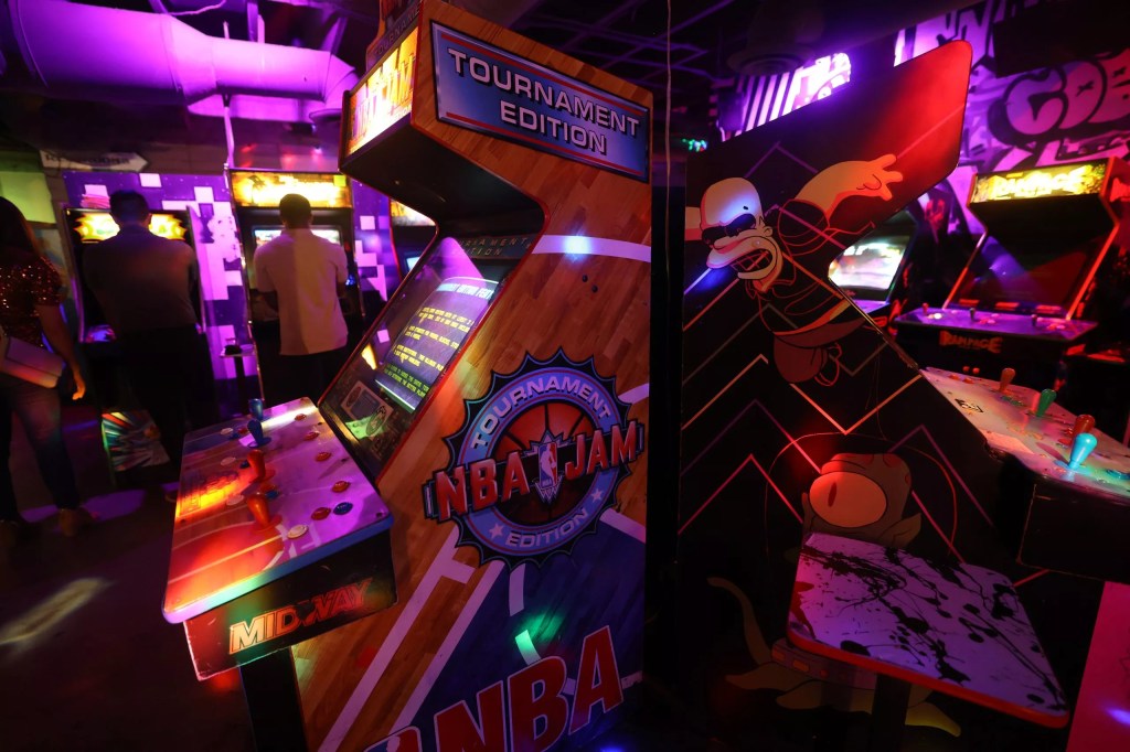 Old-school arcade game cabinets.
