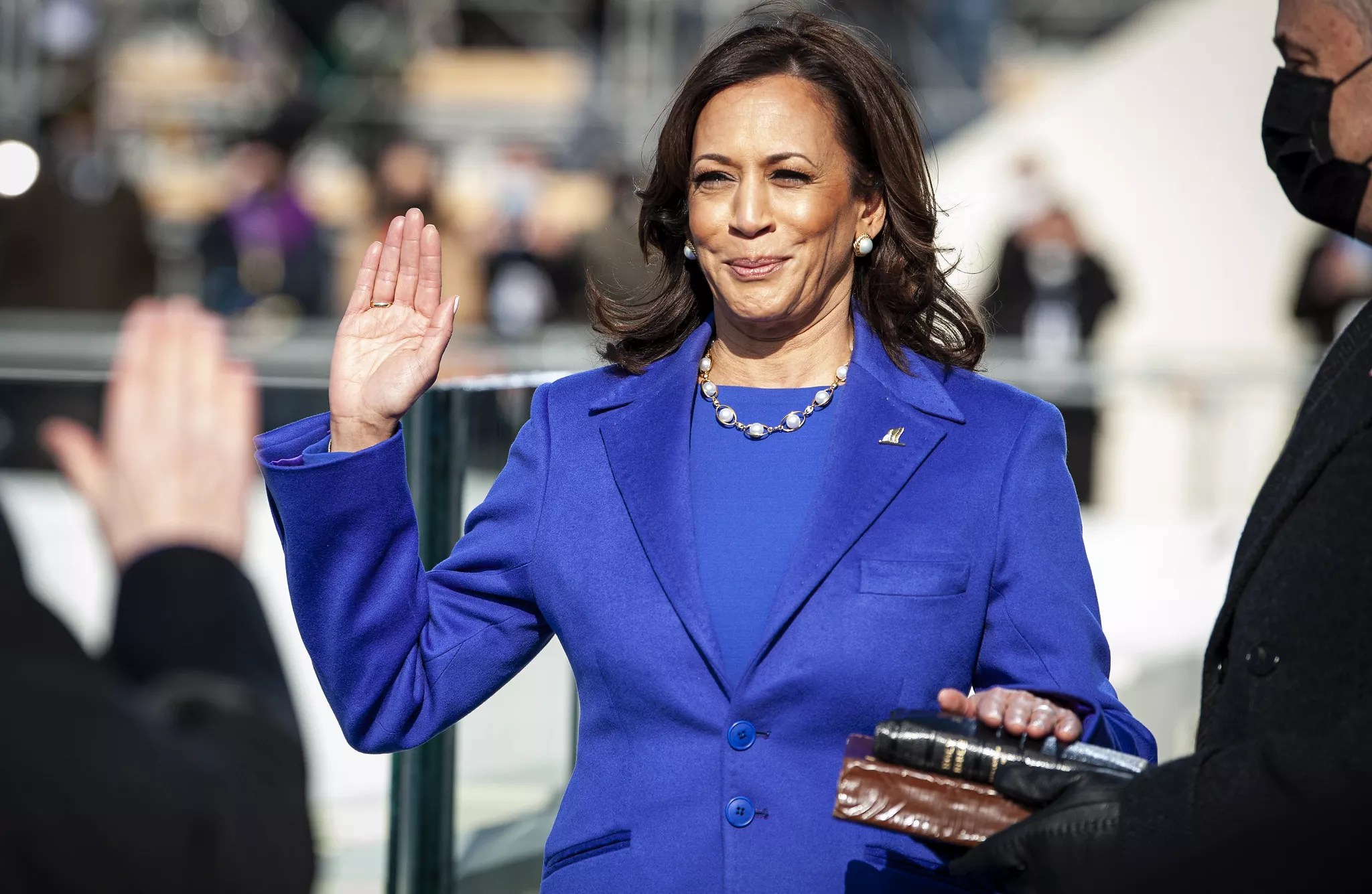 kamala harris with her hand on a bible