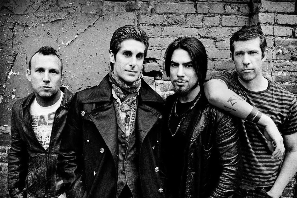 A black and white photo of a rock band.