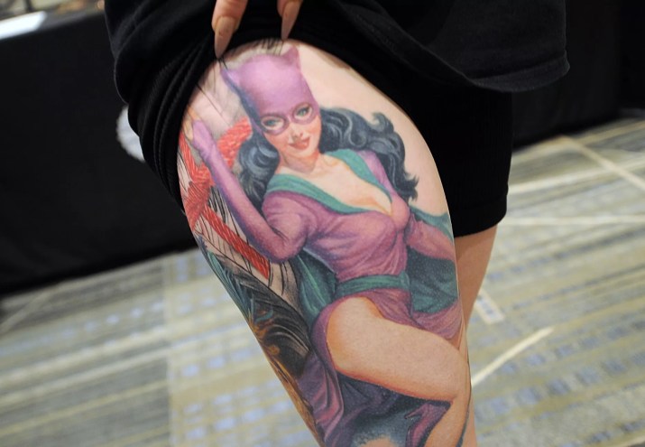 A retro Catwoman tattoo on a leg.