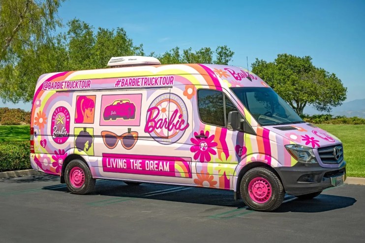 A colorful van with the word Barbie on it.